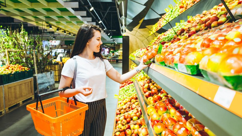 young woman do shopping in supermarket.