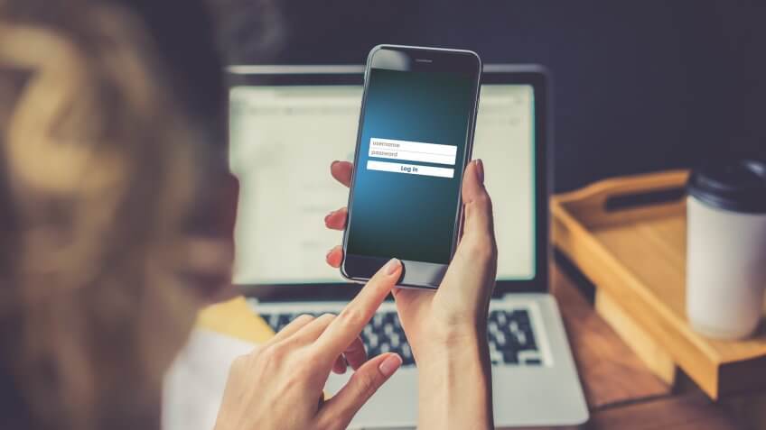 woman using phone to log in