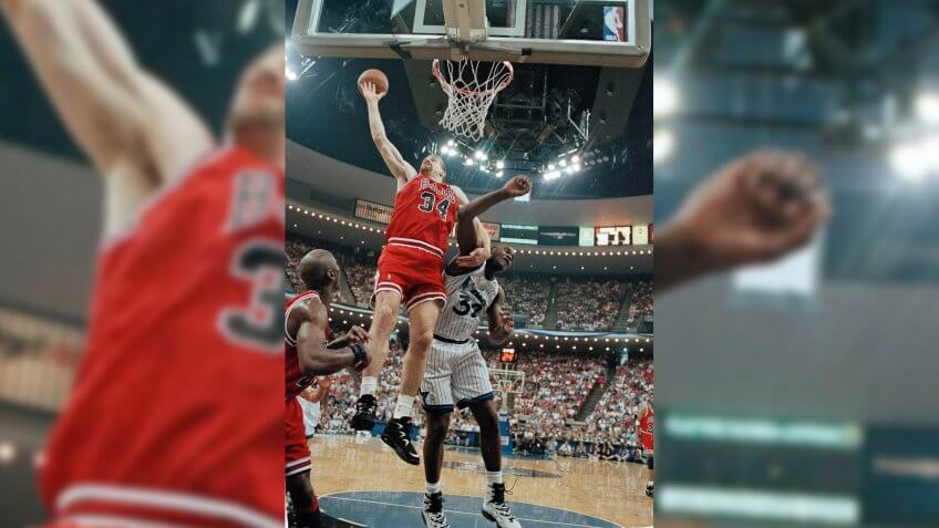 Bill Wennington, Shaquille O'Neal, Michael Jordan Chicago Bulls' center Bill Wennington (34) locks arms with Orlando Magic center Shaquille O'Neal (32) as they battle for a rebound during their first semi-final playoff game at the Orlando Arena, Orlando, Fla.