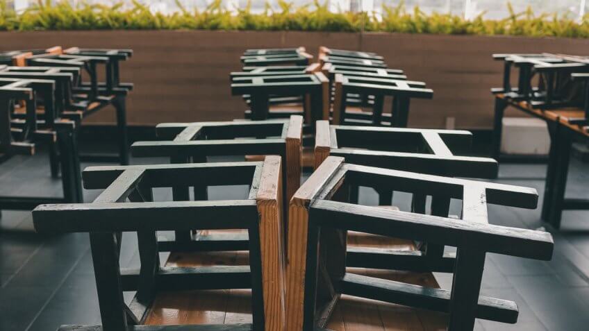 Restaurant's closing time keeping chair on table.