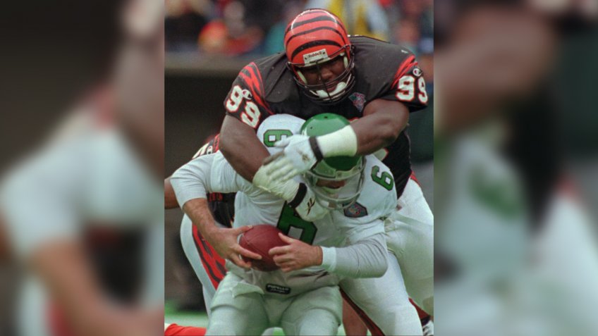 Mandatory Credit: Photo by Tom Uhlman/AP/Shutterstock (6508854a)WILKINSON BRISTER Cincinnati Bengals defensive tackle Dan Wilkinson (99) sacks Phildelphia Eagles quarterback Bubby Brister (6) during the second half, in CincinnatiBENGALS EAGLES, CINCINNATI, USA.