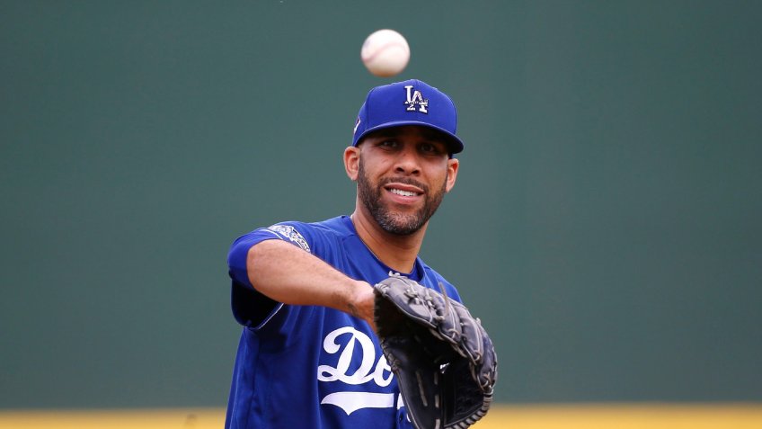 Mandatory Credit: Photo by Ross D Franklin/AP/Shutterstock (10572712bl)Los Angeles Dodgers starting pitcher David Price gets the baseball back from his catcher as he warms up during the second inning of a spring training baseball game against the Cincinnati Reds, in Goodyear, ArizDodgers Reds Spring Baseball, Goodyear, USA - 02 Mar 2020.