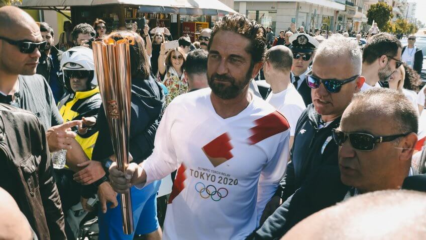 Mandatory Credit: Photo by Uncredited/AP/Shutterstock (10582064g)Actor Gerard Butler runs as a torchbearer during the Olympic torch relay of the 2020 Tokyo Olympic Games in the southern Greek town of Sparta, .