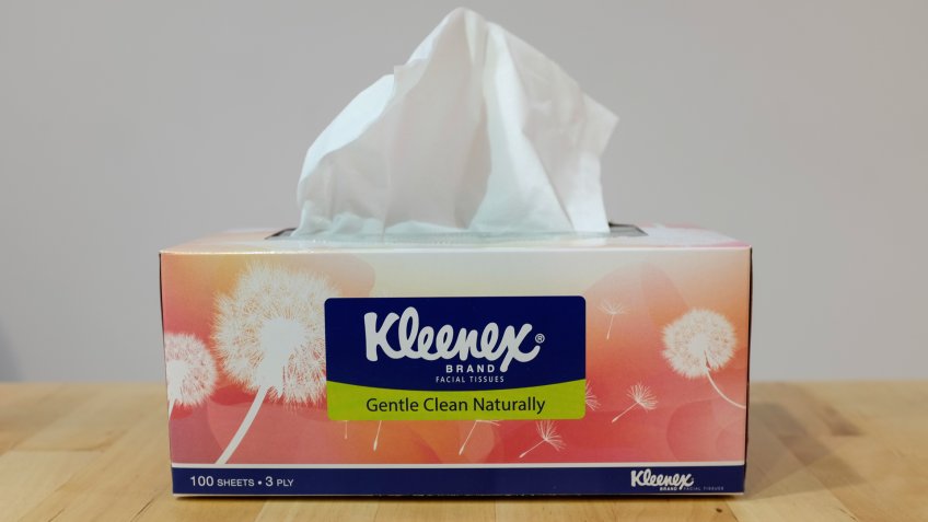 Ampang, Kuala Lumpur - April 12, 2018 : Photo taken of a box of Kleenex on wooden surface & white background.