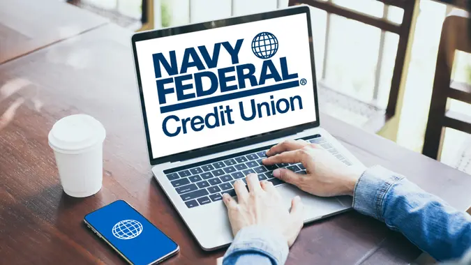 Navy Federal Credit Union logo on laptop and smartphone