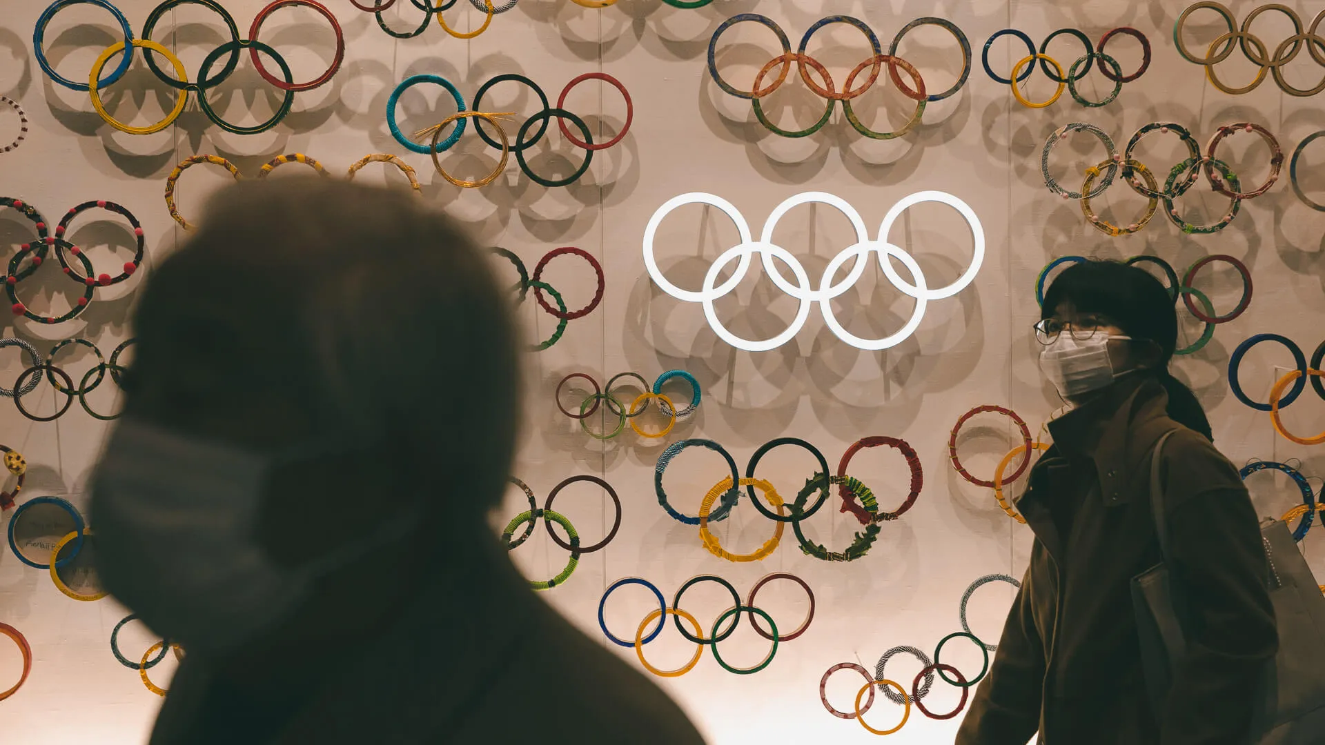 Mandatory Credit: Photo by Jae C Hong/AP/Shutterstock (10566471b)Two people wear masks as they visit the newly opened Japan Olympic Museum located near the New National Stadium, in TokyoThe Prospects, Tokyo, Japan - 23 Feb 2020.