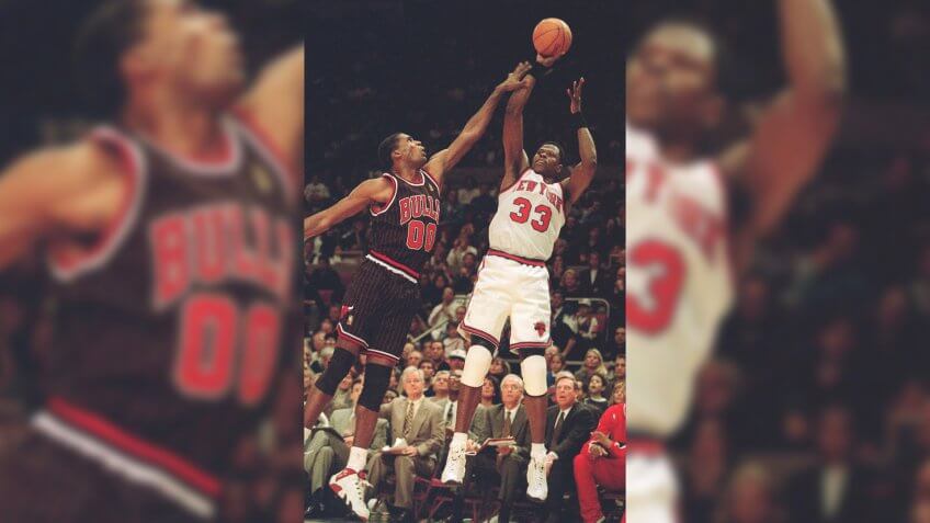 EWING PARISH New York Knicks Patrick Ewing, right, takes the final shot of the game over Chicago Bulls Robert Parish, left, during game action, in New York.