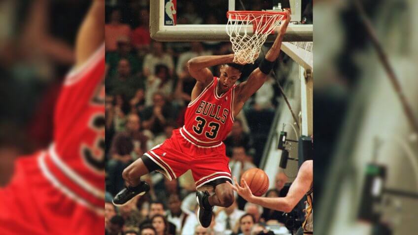 Chicago Bulls' Scottie Pippen hangs on the rim after dunking against the Indiana Pacers during the first half of Game 3 of the Eastern Conference finals in IndianapolisBULLS PACERS, INDIANAPOLIS, USA.