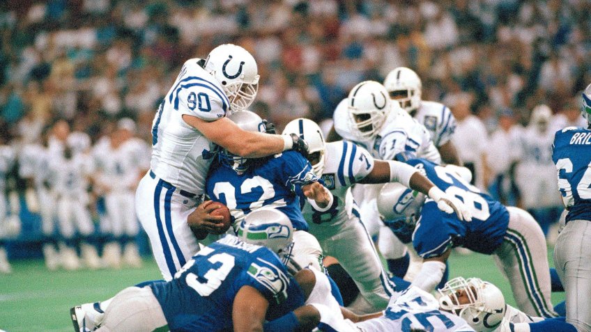 Mandatory Credit: Photo by Barry Sweet/AP/Shutterstock (6034262a)Steve Emtman (90) of the Indianapolis Colts tackles running back John L.