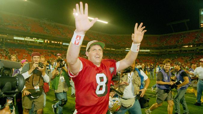 Mandatory Credit: Photo by Lenny Ignelzi/AP/Shutterstock (6528636a)Young San Francisco 49ers' Steve Young runs a victory lap after his team beat the San Diego Chargers in Super Bowl XXIX, at Miami's Joe Robbie Stadium.