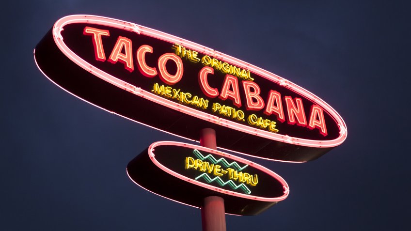 DALLAS, Tx, USA - APR 17, 2016: Taco Cabana Mexican fast food restaurant logo illuminated at night.