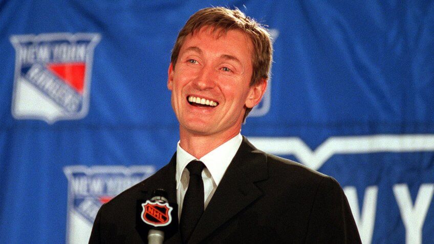 New York Rangers Wayne Gretzky smiles during a news conference at New York's Madison Square Garden after announcing his retirement from hockey .