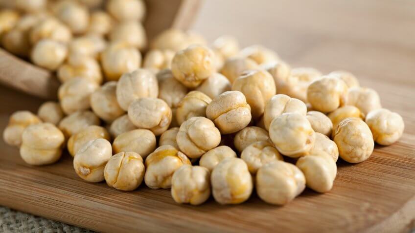 Chick-peas on wooden plankSEE MY LIGHTBOX.