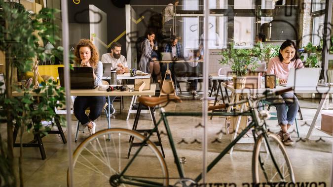 Arriving To Work By Bike Bicycle in co-working space.