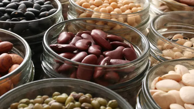 Variety of beans inside jars.