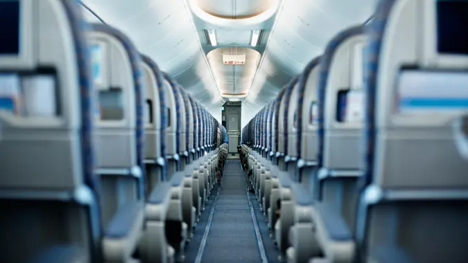 Row of empty airplane seats.