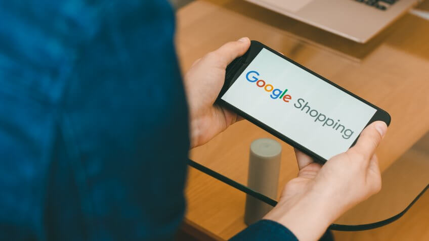SAN FRANCISCO, US - 22 April 2019: Close up to female hands holding smartphone using Google Shopping Service, San Francisco, California, USA.