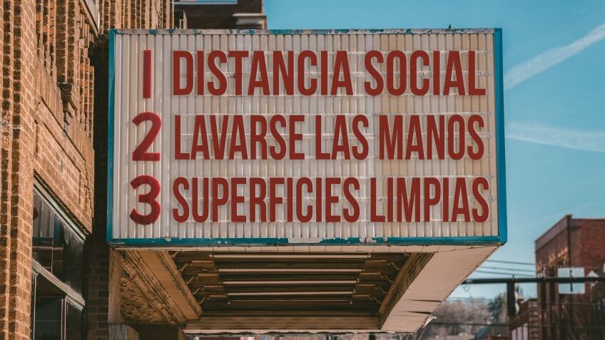 Spanish movie cinema billboard with three rules to avoid the coronavirus epidemic.
