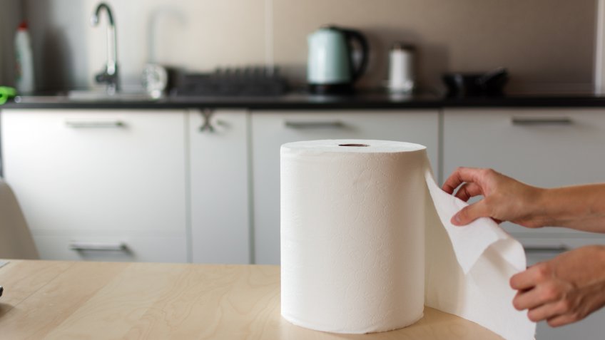 Huge roll of paper towels on kitchen table.