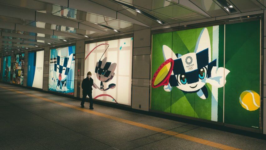 Mandatory Credit: Photo by Jae C Hong/AP/Shutterstock (10591011m)Man walks past large displays promoting the Tokyo 2020 Olympics in Tokyo, .
