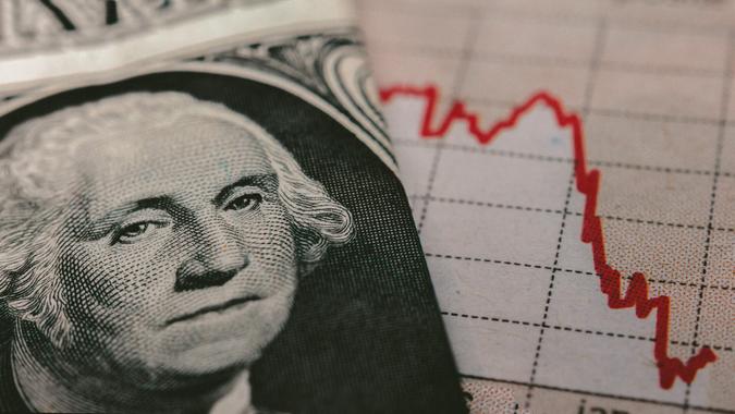 Stock Market Graph next to a 1 dollar bill (showing former president Washington).
