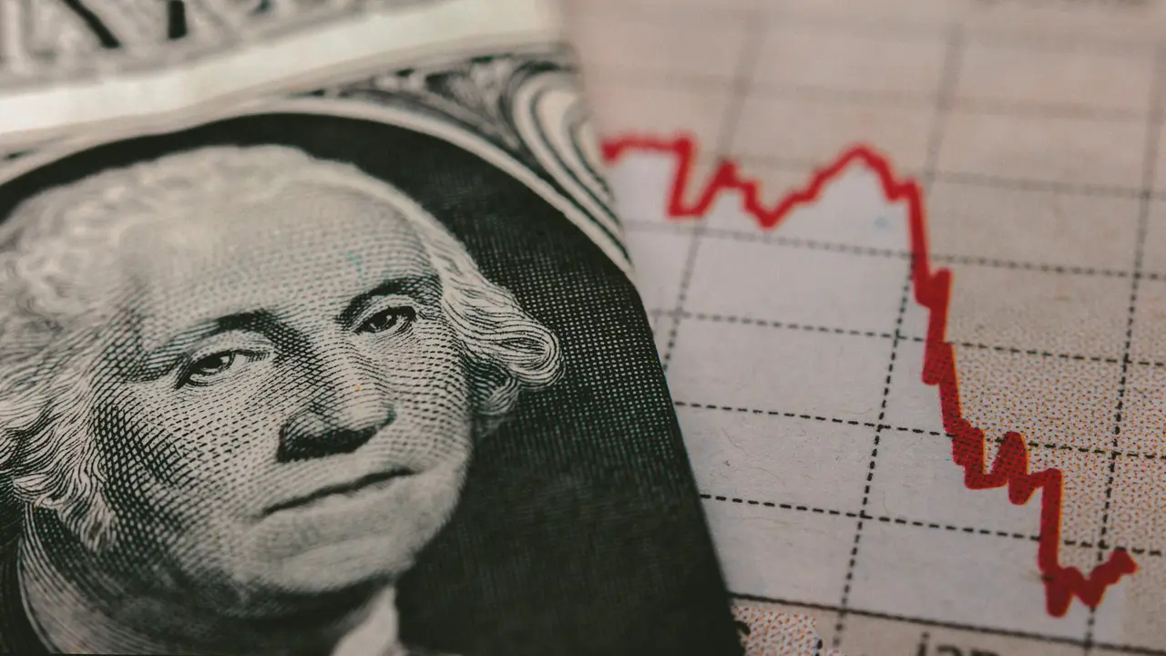 Stock Market Graph next to a 1 dollar bill (showing former president Washington).