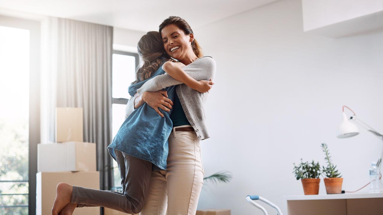 Cropped shot of an attractive young woman and her daughter dancing while moving into their new home.