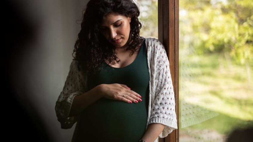 Pregnant woman at home.