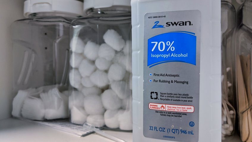 Seattle, WA / USA - circa March 2020: Isopropyl alcohol and hydrogen peroxide in a medical cabinet with cotton balls.
