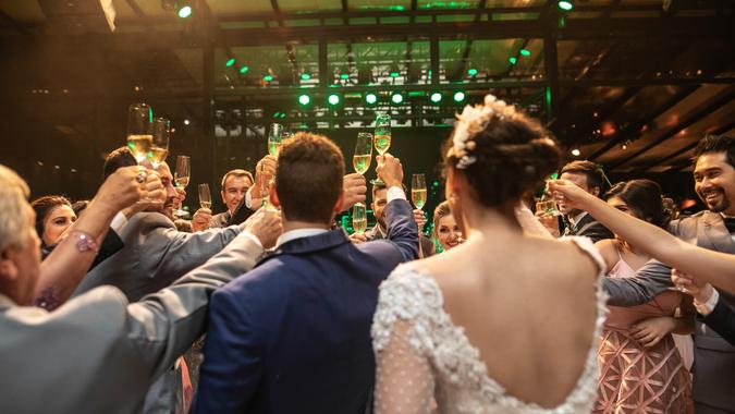 Bride, groom and wedding guests making a toast Bride, groom and wedding guests making a toast.