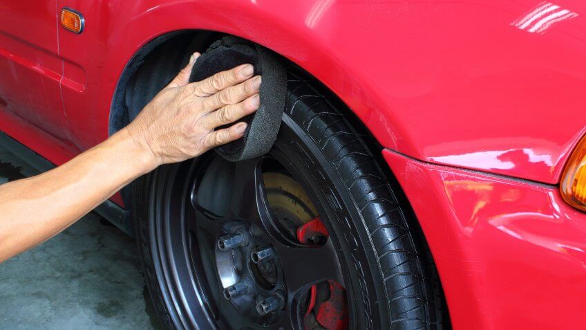 wiping down car tires