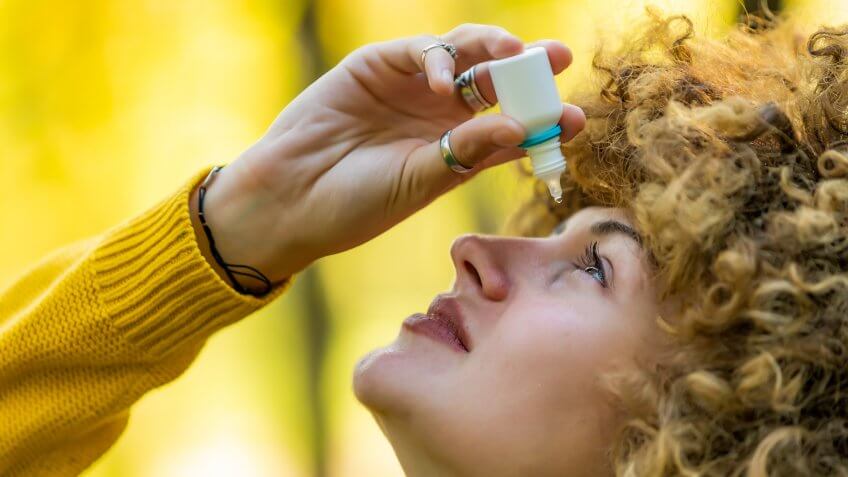 Woman Uses Eye Drops for Eye Treatment.