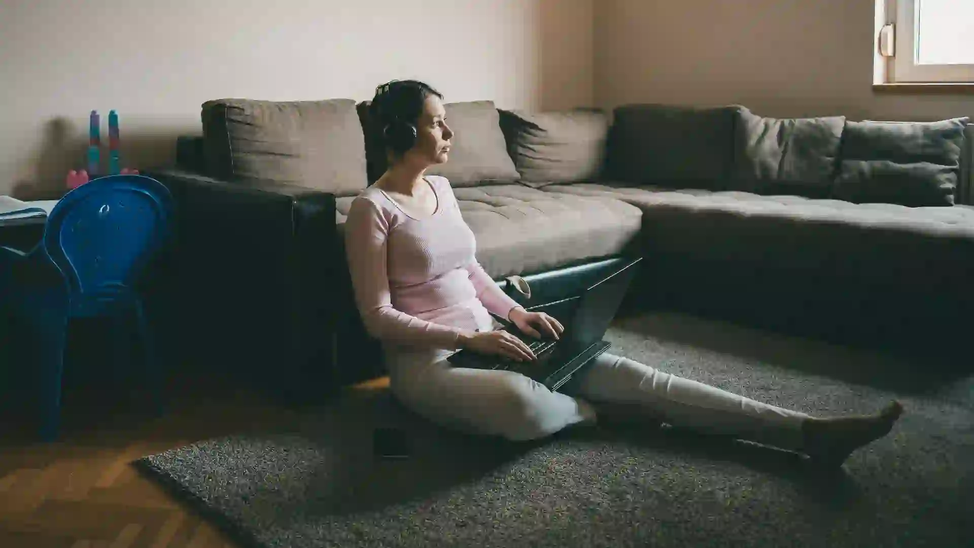 Woman working alone from home having conference call, corona virus isolation and quarantine, freelance jobs.
