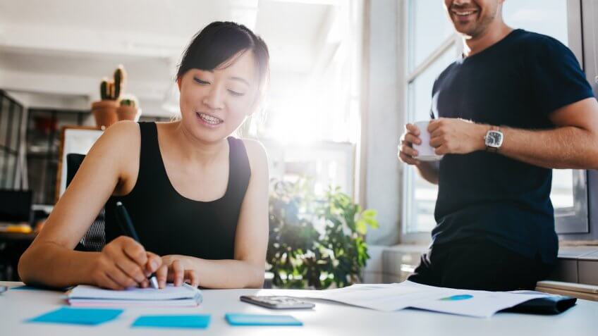 woman working on budget and finances with husband.