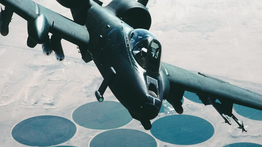 An A-10A Thunderbolt II aircraft flies over a target area during Operation Desert Storm.