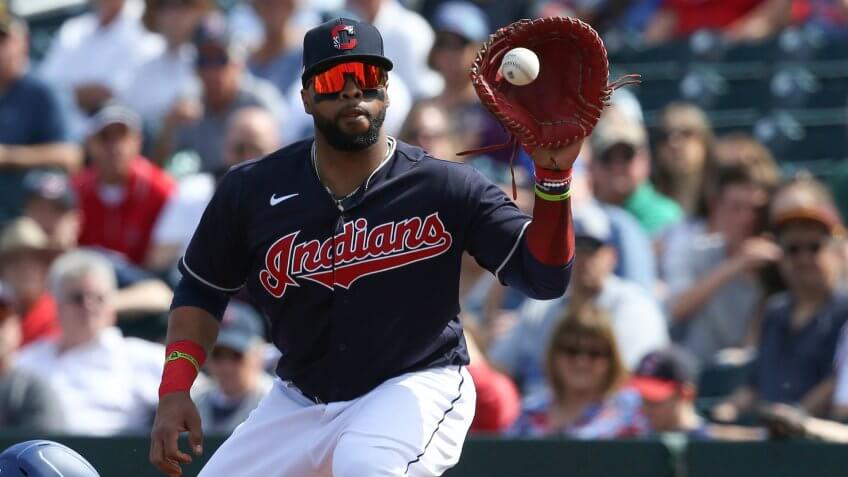 Mandatory Credit: Photo by Ross D Franklin/AP/Shutterstock (10569389e)Cleveland Indians first baseman Carlos Santana makes a catch on a pick off throw during the first inning of a spring training baseball game against the Los Angeles Dodgers, in Goodyear, ArizDodgers Indians Spring Baseball, Goodyear, USA - 27 Feb 2020.