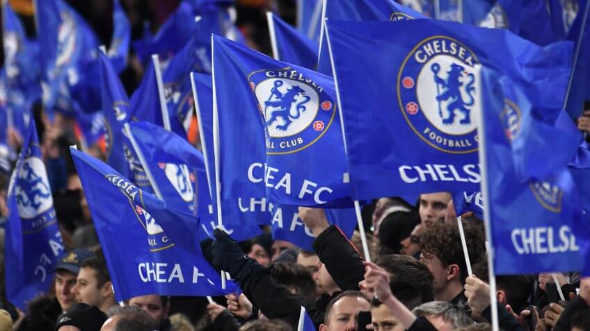 LONDON, UK - FEBRUARY 20, 2018: Chelsea fans with flagspictured during the first leg of the UEFA Champions League last 16 round match between Chelsea FC and FC Barcelona at Stamford Bridge.