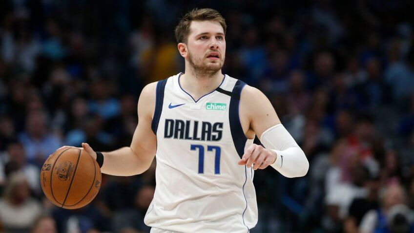 Mandatory Credit: Photo by Ron Jenkins/AP/Shutterstock (10593030a)Dallas Mavericks guard Luka Doncic (77) handles the ball against the Denver Nuggets during the second half of an NBA basketball game in Dallas.