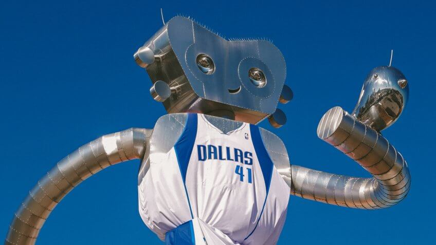 DEEP ELLUM STATION, DALLAS DEC 6: The DART Train Station is home to a three-part stainless steel sculpture series called The Traveling Man by local artist Brandon Oldenburg.