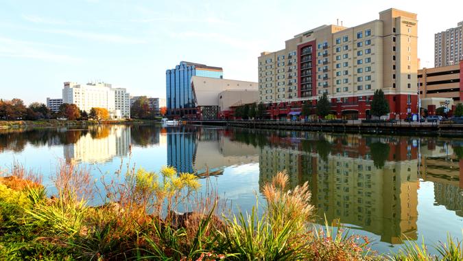 Gaithersburg, Maryland, USA - November 2, 2016: Daytime view of the Gaithersburg skyline reflecting on a pond along the Washingtonian waterfront.