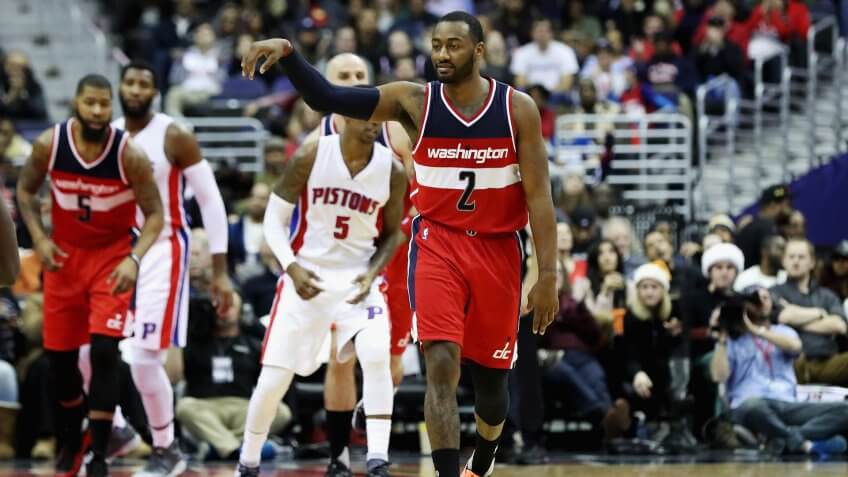 WASHINGTON, DC - DECEMBER 16: John Wall #2 of the Washington Wizards celebrates after scoring against the Detroit Pistons at Verizon Center on December 16, 2016 in Washington, DC.