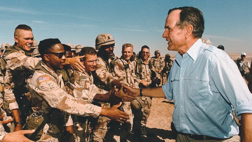 President George H W Bush talks with Saudi Arabia troops 1990 Pe