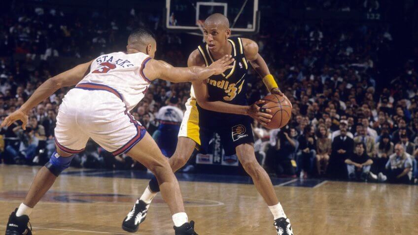 MANHATTAN, NY - CIRCA 1990's: Guard Reggie Miller #31 of the Indiana Pacers is guarded closely by John Starks #3 of the New York Knicks circa mid 1990's during an NBA basketball game at Madison Square Garden in Manhattan, New York.