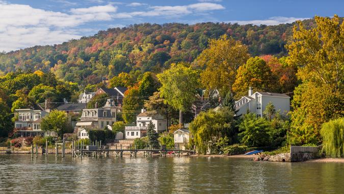 Landscape with Trees in Autumn Colors (Foliage), Hudson River, Houses and Blue Sky, Nyack, Rockland County, Hudson Valley, New York.