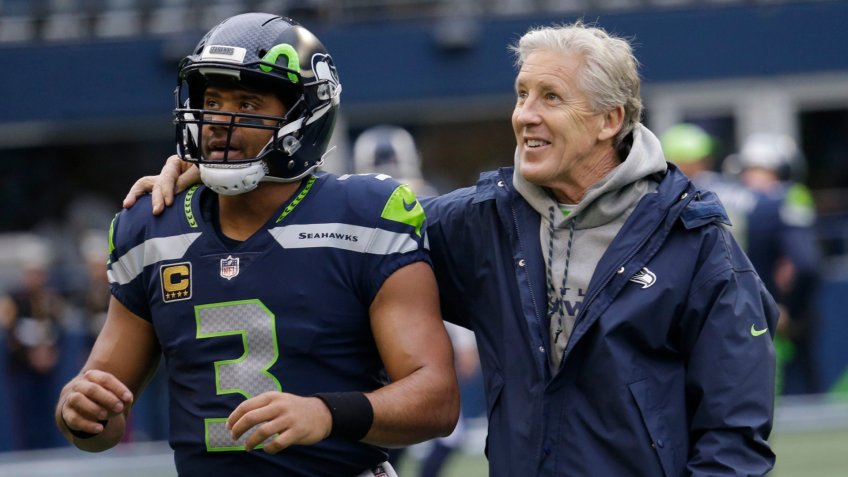 Mandatory Credit: Photo by Elaine Thompson/AP/Shutterstock (9295612g)Seattle Seahawks head coach Pete Carroll, right, stands with quarterback Russell Wilson (3) before an NFL football game against the Los Angeles Rams, in SeattleRams Seahawks Football, Seattle, USA - 17 Dec 2017.