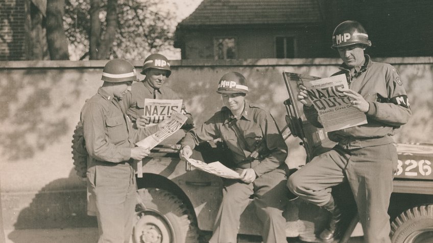 US MPs read Nazi Quits Newspaper for VE Day