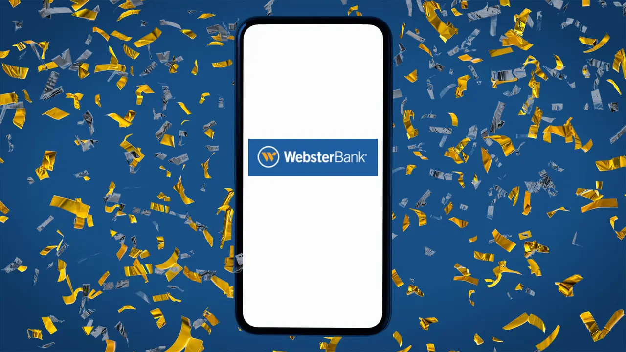 Mobile phone displaying Webster Bank app with logo, promoting mobile banking features and current account offers.