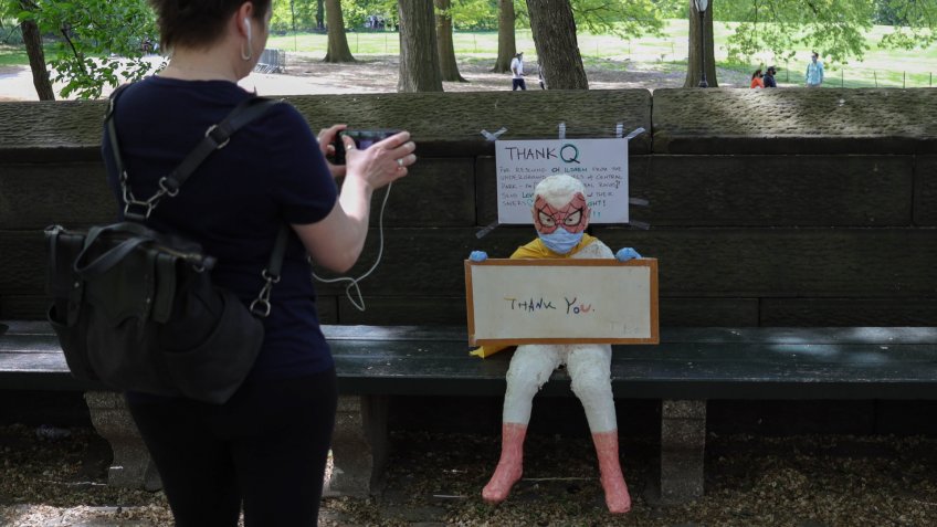 Mandatory Credit: Photo by William Volcov/Shutterstock (10649318c)A statue of a child wearing a face mask and a spiderman mask contains a note of thanks to medical and essential workers outside Mount Sinai Hospitalon Manhattan Island in the United States.
