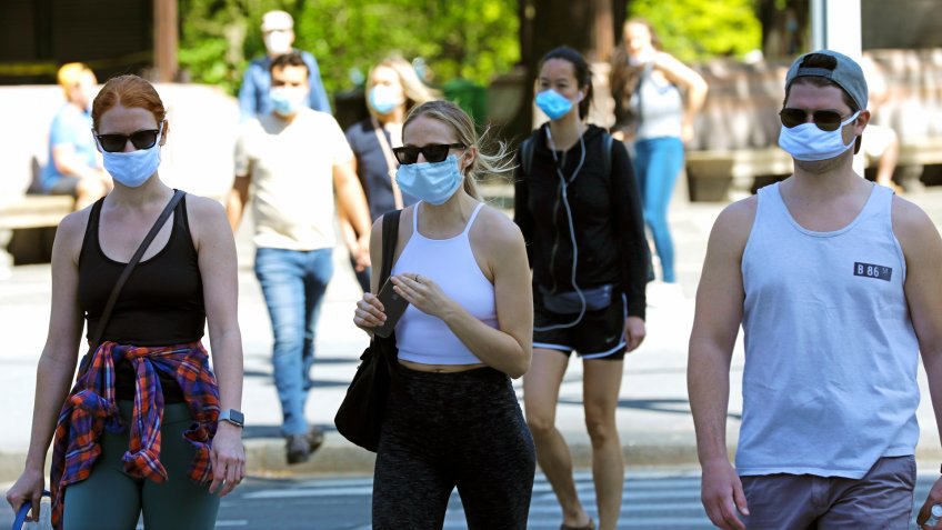 Mandatory Credit: Photo by Peter Foley/EPA-EFE/Shutterstock (10649806i)People exit Central Park wearing face covering in New York, New York, USA, 17 May 2020.