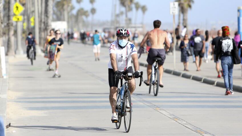 Mandatory Credit: Photo by David Buchan/Shutterstock (10649950r)LA County beaches re-open recently for ocean activities and exercise with restrictions: Gathering, sitting and sunbathing are NOT allowed and at east 6 feet physical distancing required.